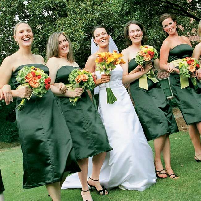 Diane chose strapless, dark green, knee-length dresses accented with chartreuse sashes by Watters & Watters for her bridesmaids. To keep things comfortable, the bridesmaids wore their own shoes for the ceremony.