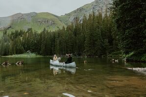 Bride and Groom on a Canoe Ride on a Lake at Their Telluride, Colorado, Venue