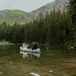Bride and Groom on a Canoe Ride on a Lake at Their Telluride, Colorado, Venue