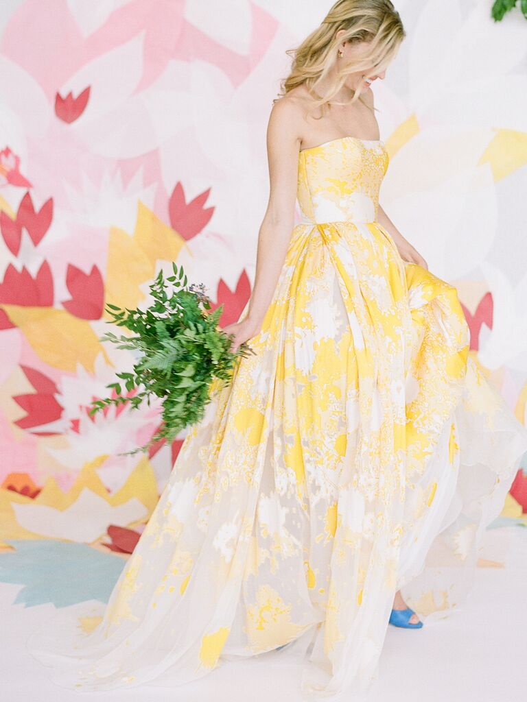 Strapless yellow and white Romona Keveza​ wedding gown