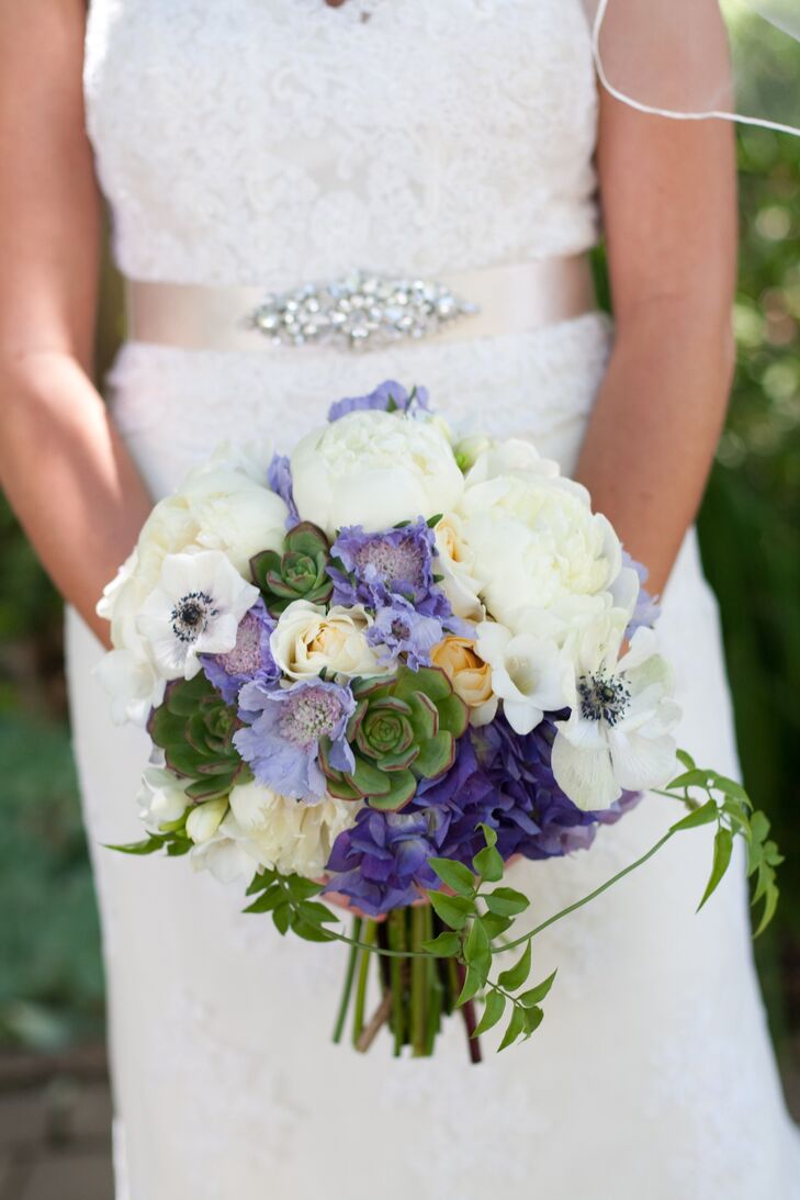 Jen mixed soft feminine peonies, scabiosa and anemones with bold succulents for an interesting textured bridal bouquet.
