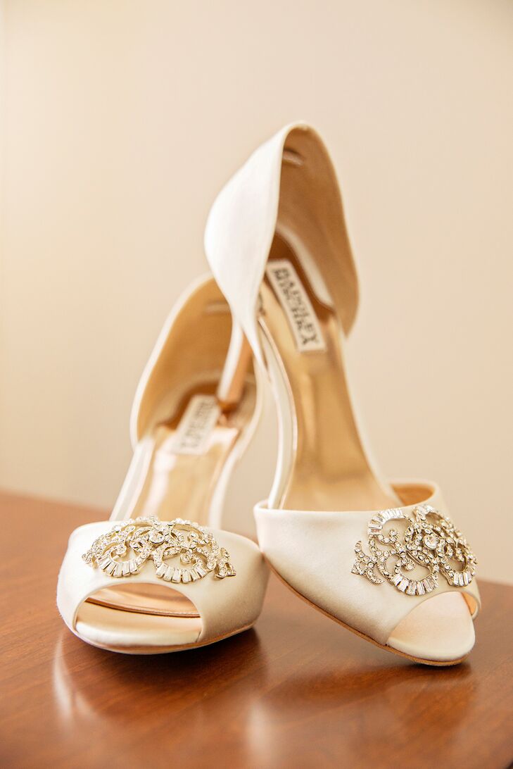 The bride paired her Pronovias dress with satin, peep-toe, Badgley Mischka heels.