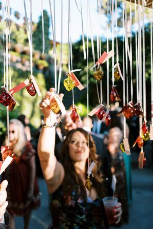 Guests Searching for Their Escort Card From Hanging Glass Heart Display