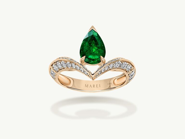 Floating emerald engagement ring by Marei New York. 