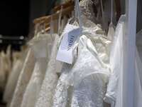 davids bridal gowns on a rack 