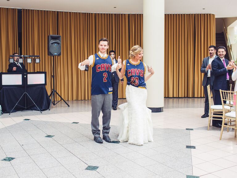Bride and groom wearing Cleveland Cavaliers jerseys. 
