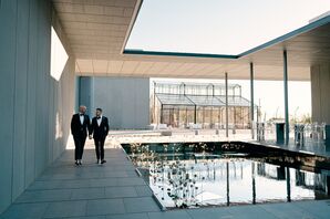 Couple Walking Beside Reflecting Pool at Hall of Lights in Carrollton, Texas