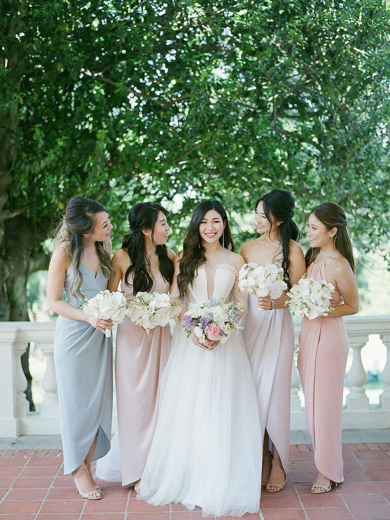 Bride with bridesmaids in summery pastel dresses