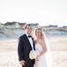 Ryan fell in love with the casual sophistication of this Jim Hjelm dress. Its strapless neckline, classic silhouette and lace detailing made it formal enough for their wedding, but also laid-back enough for their beach wedding in Corolla, North Carolina.