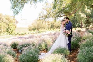 Bride in Off-the-Shoulder Dress and Groom in Navy Suit Pose Amid Ranch Greenery