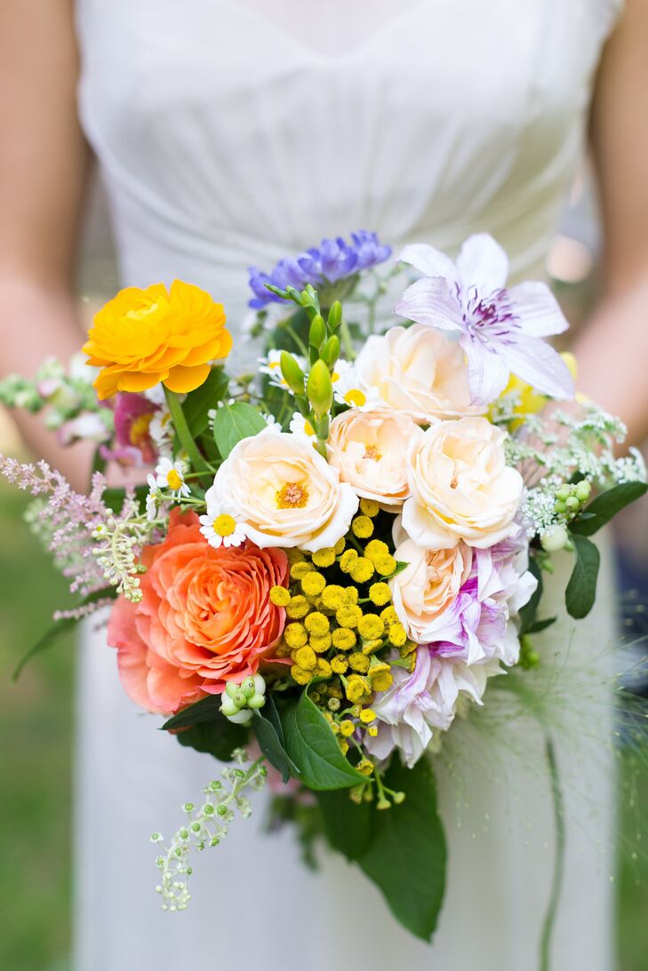 The bridesmaid bouquets were a bright mix of ranunculuses, garden roses, astilbe and lilies.