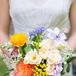 The bridesmaid bouquets were a bright mix of ranunculuses, garden roses, astilbe and lilies.