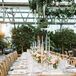 Romantic Dining Table with Taper Candles, Flower Centerpieces and Cross-back Chairs