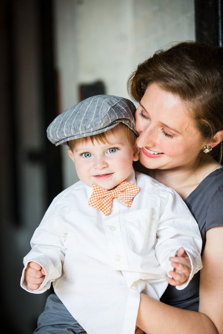 The ring bearer donned a newsboy hat, white shirt and slacks from Target. He completed his look with an orange bow tie from Neiman Marcus. Since he was too young to walk down the aisle, his parents, both part of the wedding party, pulled him in a little wagon behind them.