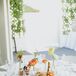 "Our reception decor had more of a desert-boho vibe," Gwynne says. "It was an eclectic combination of vintage bud vases and olive wood branches with copper and gold votives."