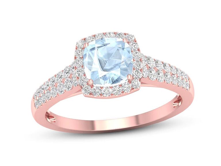 kay rose gold engagement ring with cushion cut aquamarine center stone claw prongs round diamond halo and double round diamond sides and plain rose gold band