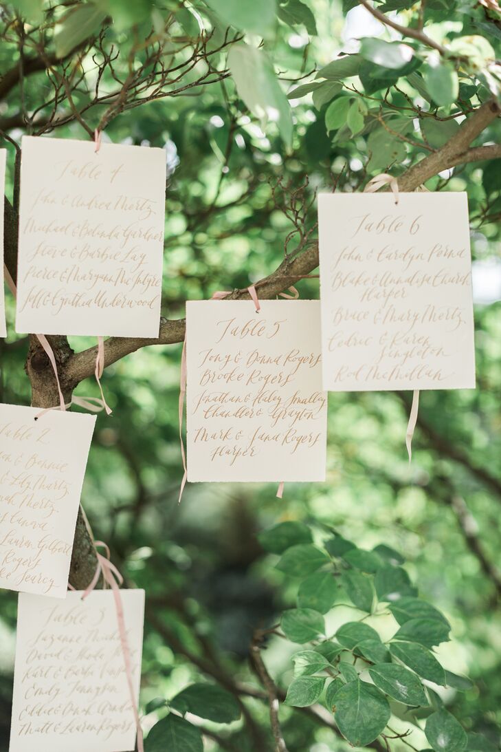 A calligrapher handwrote the place cards, which were hung from a tree just outside the ceremony space.