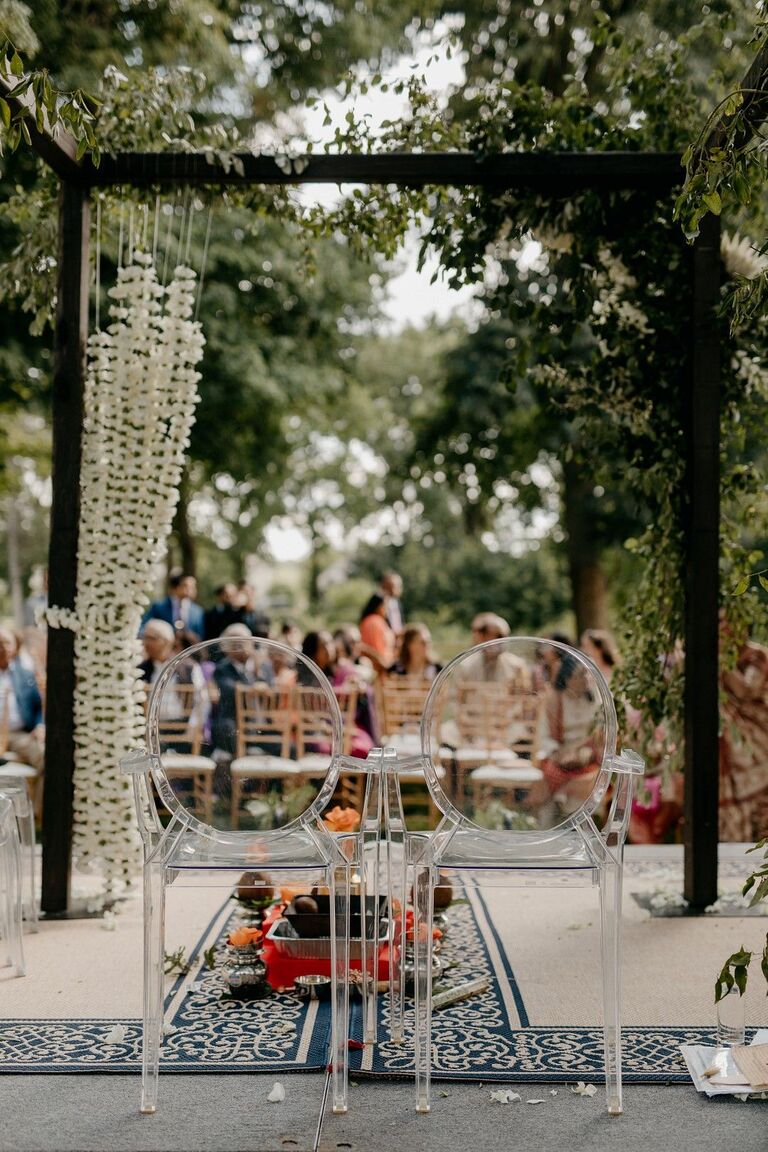 Boho mandap with ghost chairs