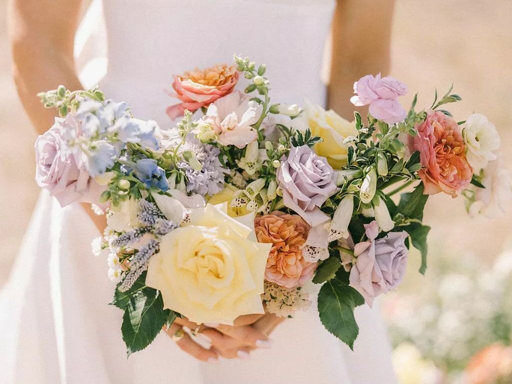 Wedding Bouquet with White Roses and Feather Accents