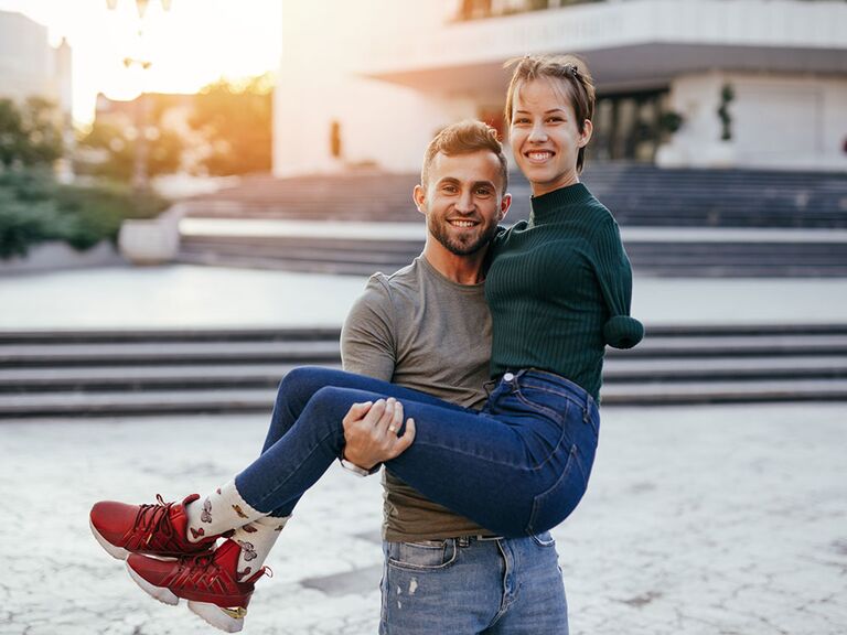 Man holding disabled woman