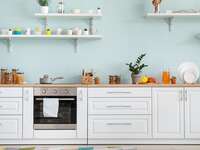kitchen counter with lots of dishes pots and pans