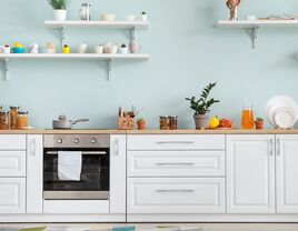 kitchen counter with lots of dishes pots and pans