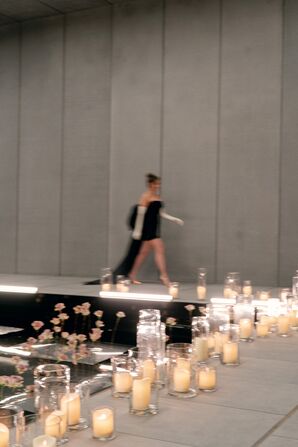 Wedding Guest in Short Dress and Gloves Walking Beside Candles