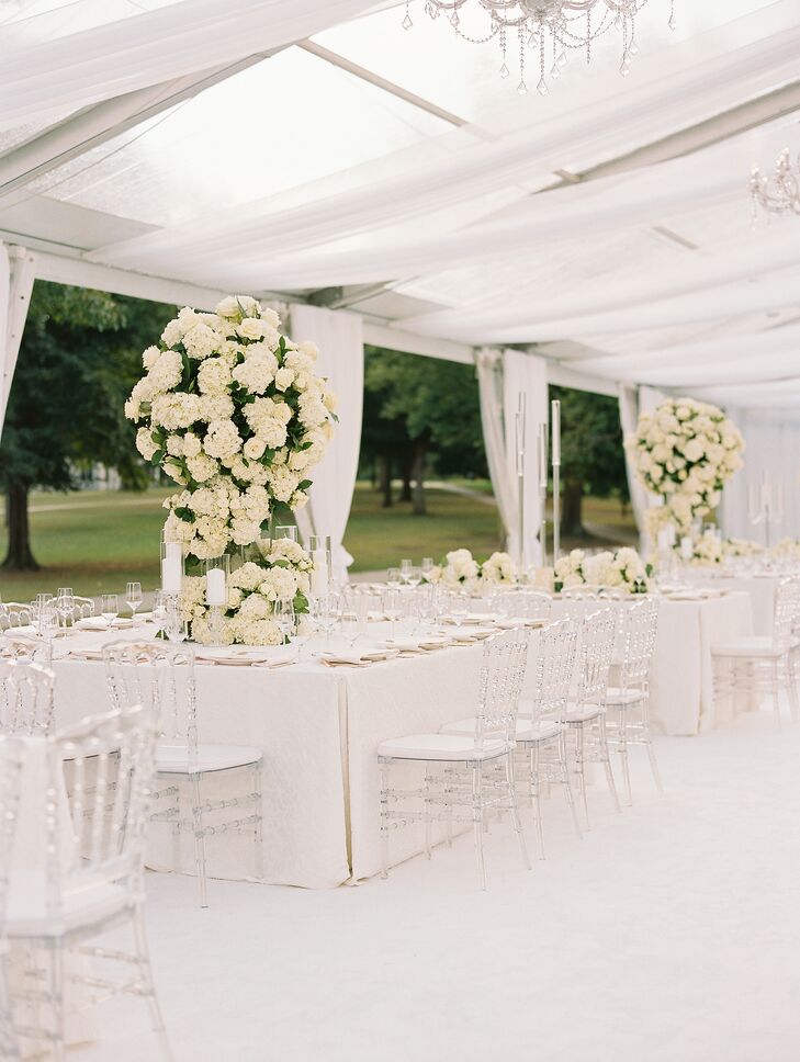 All-White Tented Reception Space With Tower Flower Centerpieces