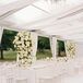 All-White Tented Reception Space With Tower Flower Centerpieces