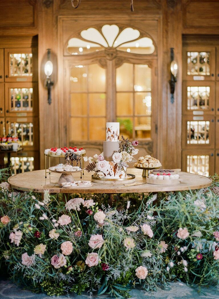Wedding cake table decorated with flowers