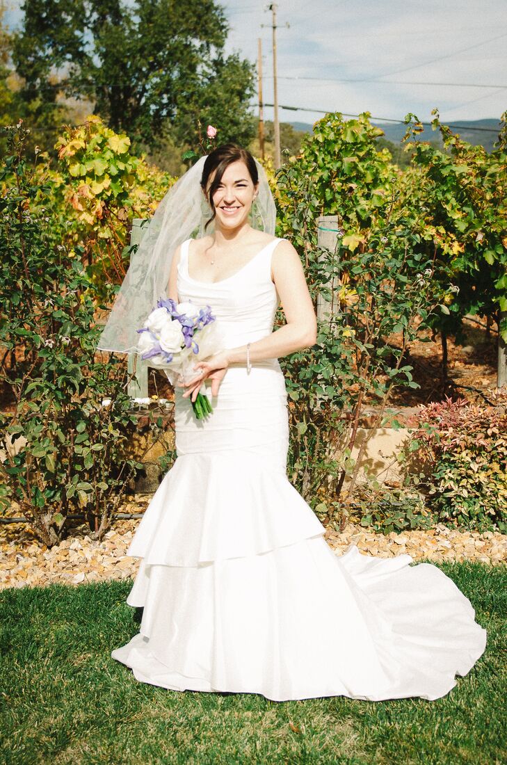 Tracey wore a trumpet style wedding gown with a tulle veil. "When I walked out of the dressing room, we all had that 'ah ha' moment," says Tracey.
