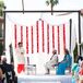 Red and White Draped Wedding Arch