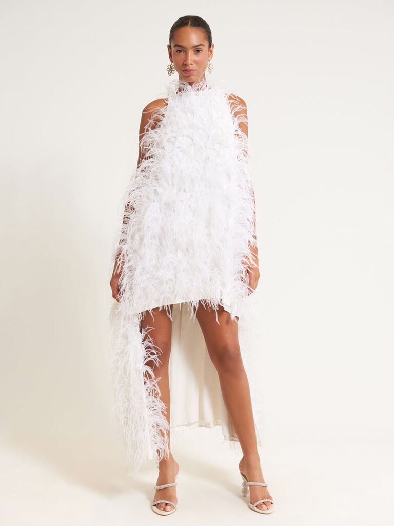 White dress embellished with feathers. 