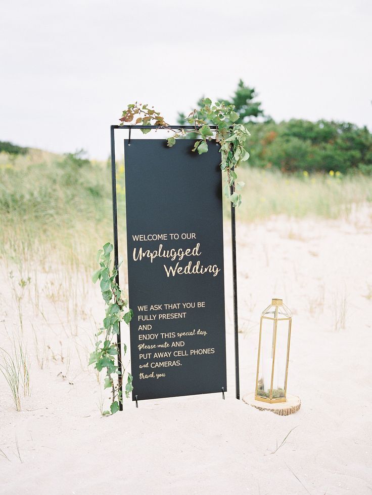 Simple black sign on beach