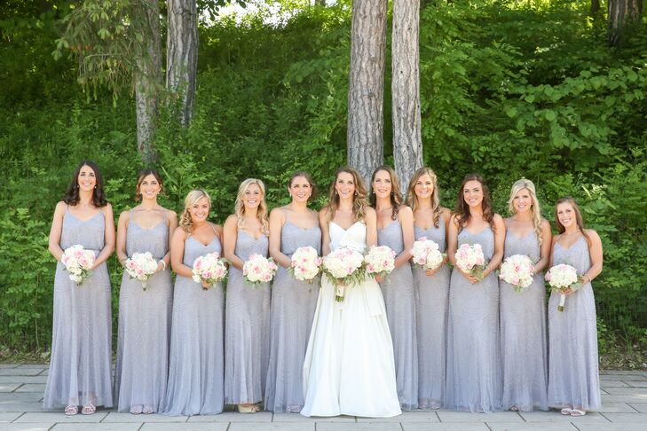 Bridesmaids wore silver, embellished Adrianna Papell gowns in a silver hue. "The color was subtle and matched with the black tuxes perfectly," Lauren says. "With such a large bridal party, it was easy to have everyone order online rather than try on dresses at a bridal salon. I think all the bridesmaids appreciated the simplicity of the process."