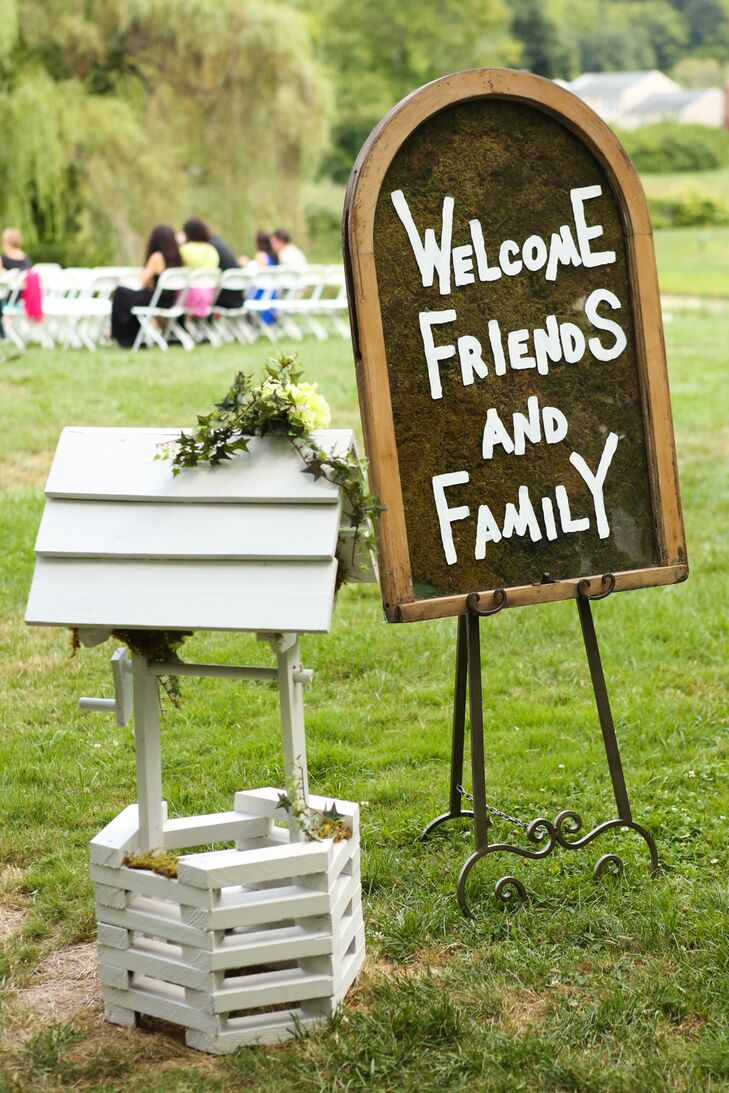 For DIY elements, Lauren and Matt had various chalkboard signs throughout their reception. One, wooden-framed sign welcomed guests to the ceremony.