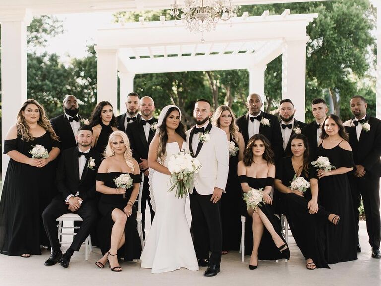 Selena Gomez and other bridesmaids smile for the camera with the bride and groom. 