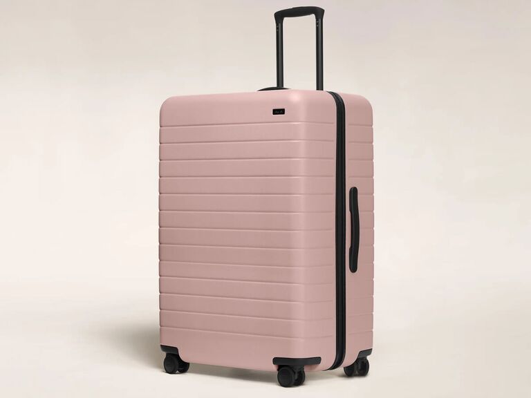 Pink large checked luggage from Away for wedding registry