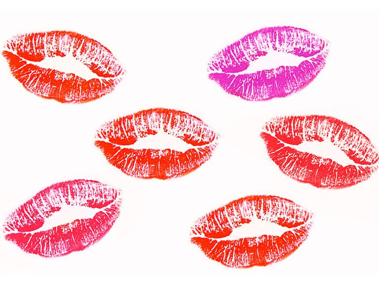 A collection of lipstick prints in different shades of red and pink.
