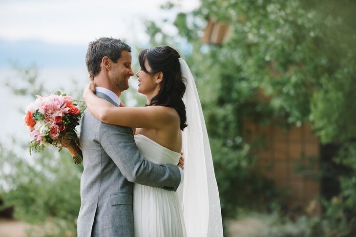Stephanie wore her hair in a half up style with loose curls. For the ceremony she added a chapel length veil.