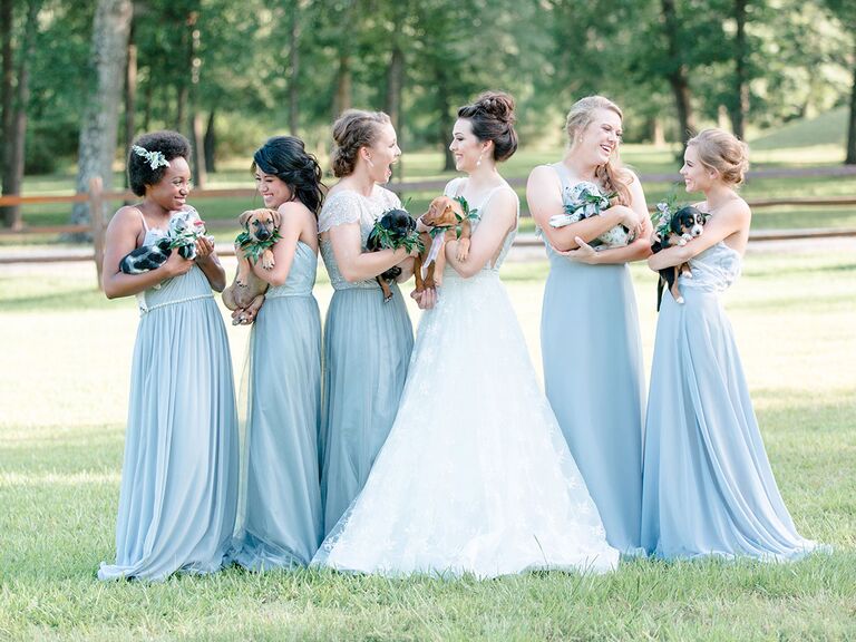 Bridesmaids with puppy bouquets