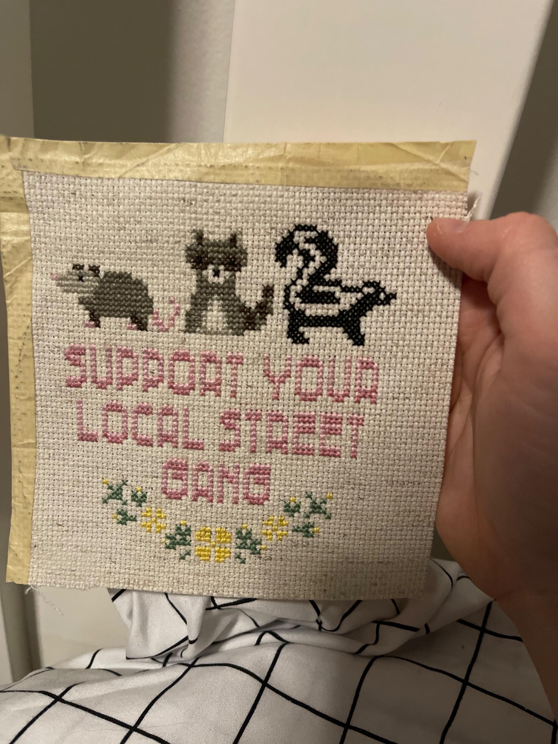 For an early Valentine’s gift, Brian gives Betsy the cross-stitch he had been working on for her during their Zoom dates. 
