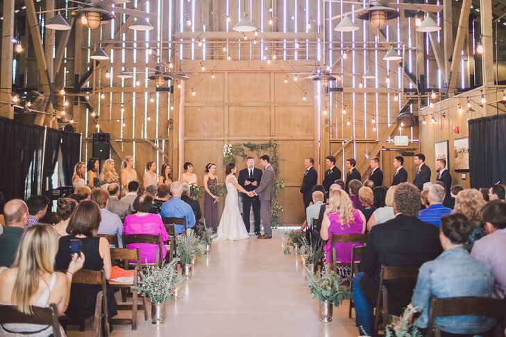 The couple held their ceremony inside the rustic barn at Camarillo Ranch in Camarillo, California, with Edison bulbs twinkling above them and their guests. "We loved our ceremony because it was handpicked by us," Melanie says. "JJ's uncle was the pastor and my friends sang our communion song. It just felt like a complete reflection of our values."