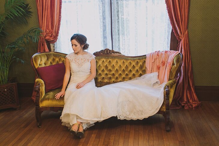 Melanie wore an ivory wedding dress that was accented with lace on the bodice and covered the entirety of the dress, all the way down to the train. She wore her hair pulled back in an elegant updo, which revealed her delicate silver dangling earrings.