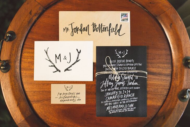 The wedding invitations were printed on black, white and yellow stationery, with calligraphy design by Melanie Stuart Designs and printed by Kindred. An antler design was printed on many of the pieces of stationery, reflecting the wedding's rustic style.