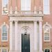 Bride and Groom on Building Steps at the University of Arkansas