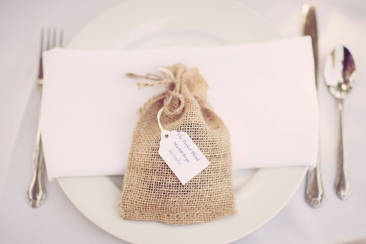The bride and groom wanted to incorporate their love of coffee into their wedding. They gave each of their guests a small burlap bag full of their favorite coffee beans.