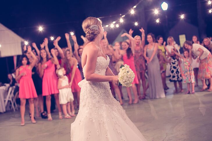Bride Throwing Bouquet of White Roses
