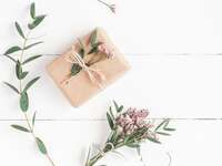 Wrapped wedding gift on white background.