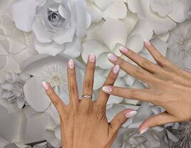 ombre wedding nails on top of flowers
